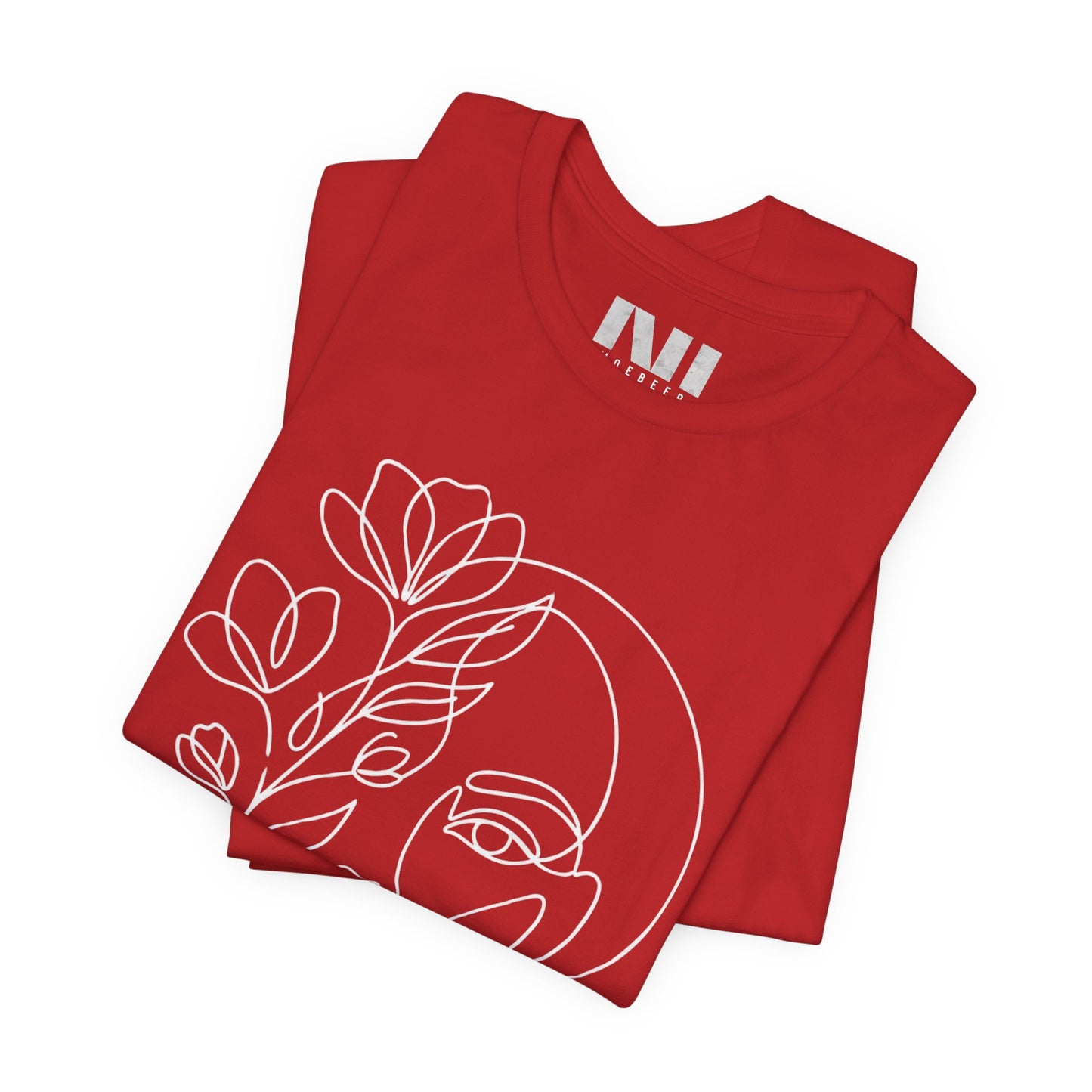 Folded Red graphic t-shirt featuring a minimalist black continuous line art design of a woman's face blooming with floral botanical elements. MOEBEER tees #Red