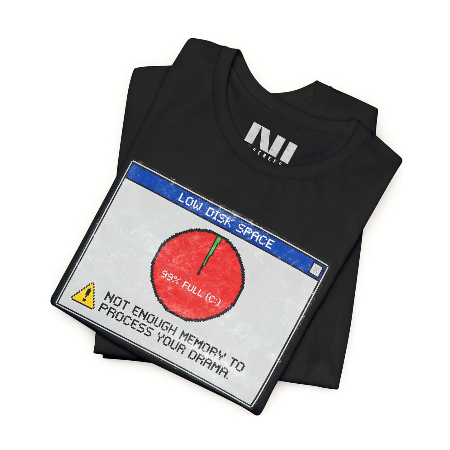 folded black graphic t-shirt featuring a retro computer error message that reads "Not enough memory to process your drama" with a 99% full disk pie chart icon. #Black