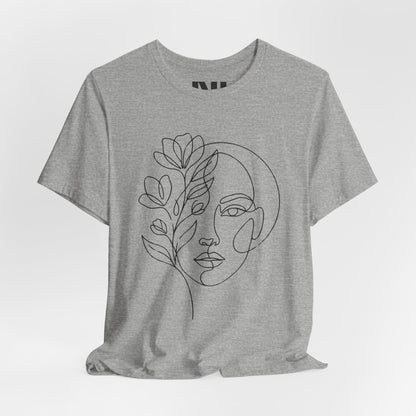 Grey Heathered graphic t-shirt featuring a minimalist black continuous line art design of a woman's face blooming with floral botanical elements. MOEBEER tees #Athletic Heather