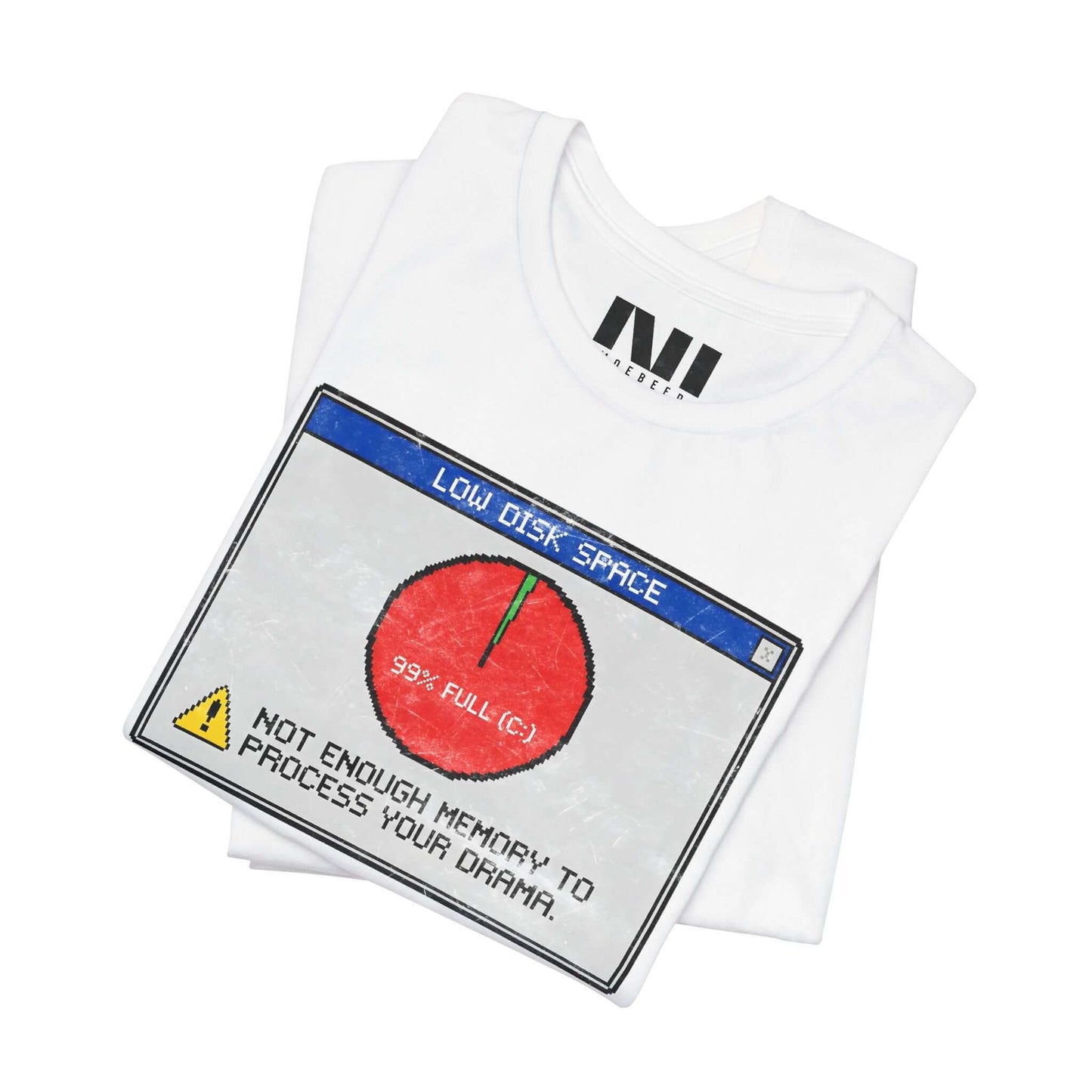 folded White graphic t-shirt featuring a retro computer error message that reads "Not enough memory to process your drama" with a 99% full disk pie chart icon. #White