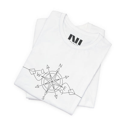 folded white color graphic t-shirt featuring a minimalist black line art compass rose design with cardinal direction markers. #White