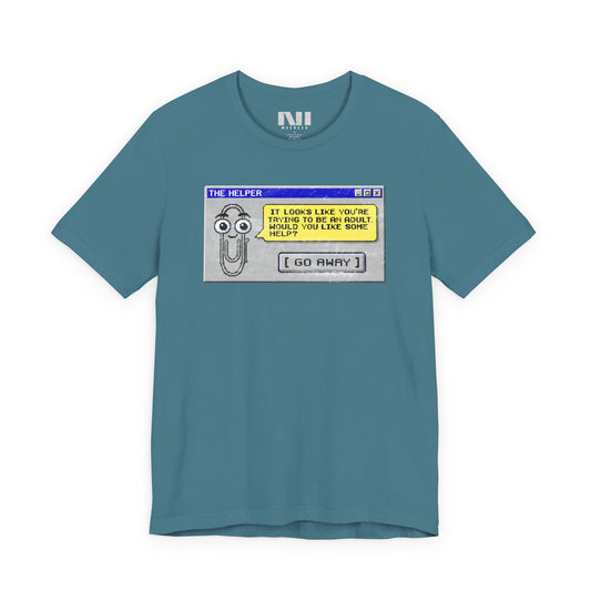Heather deep Teal t-shirt featuring a retro pixelated computer pop-up window graphic with a cartoon paperclip assistant. The text within the window reads, "IT LOOKS LIKE YOU'RE TRYING TO BE AN ADULT. WOULD YOU LIKE SOME HELP?" followed by a button that says "[ GO AWAY ]" #Heather Deep Teal