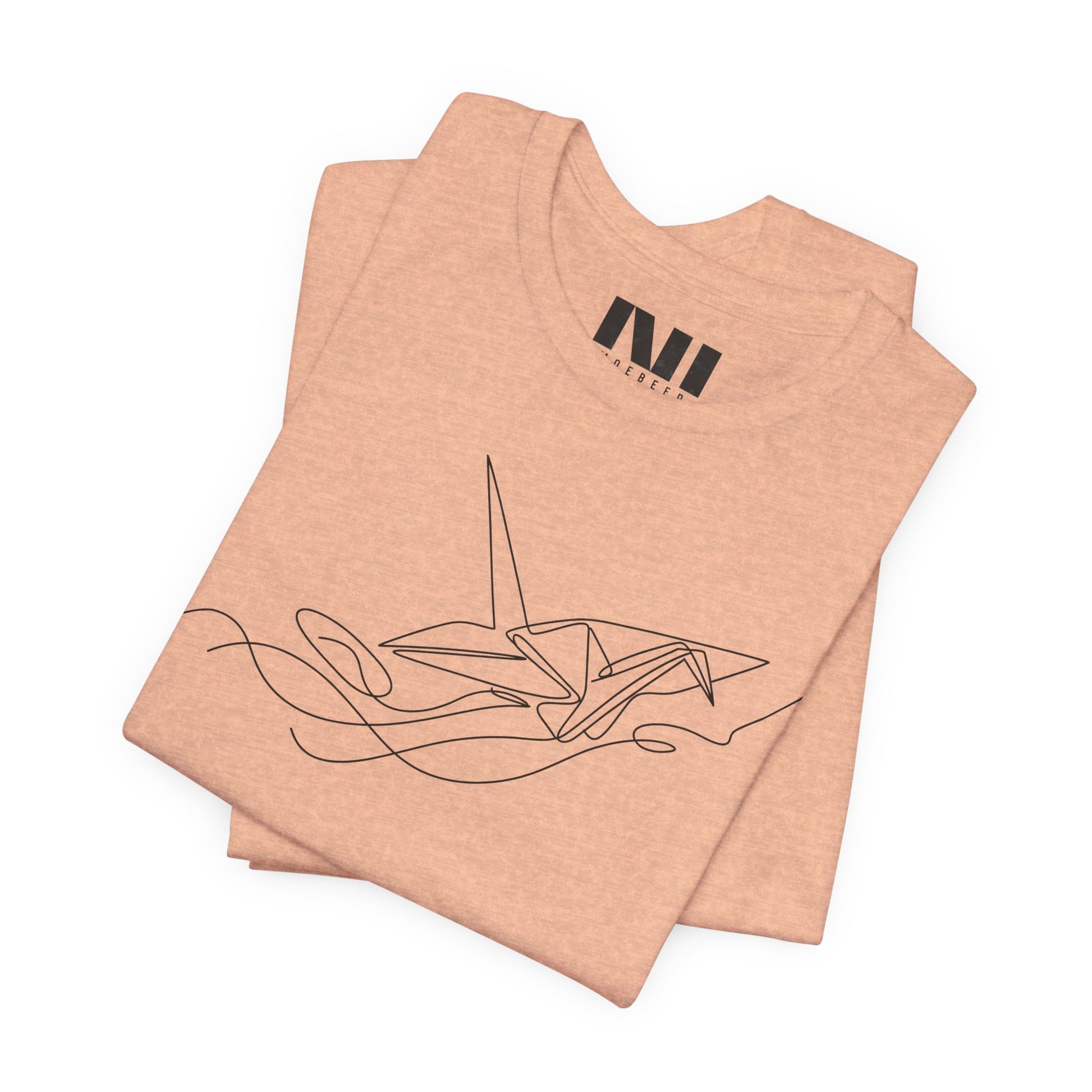 folded Heather Peach color t-shirt featuring a black minimalist continuous line art design of an origami paper crane, moebeer tees #Heather Peach