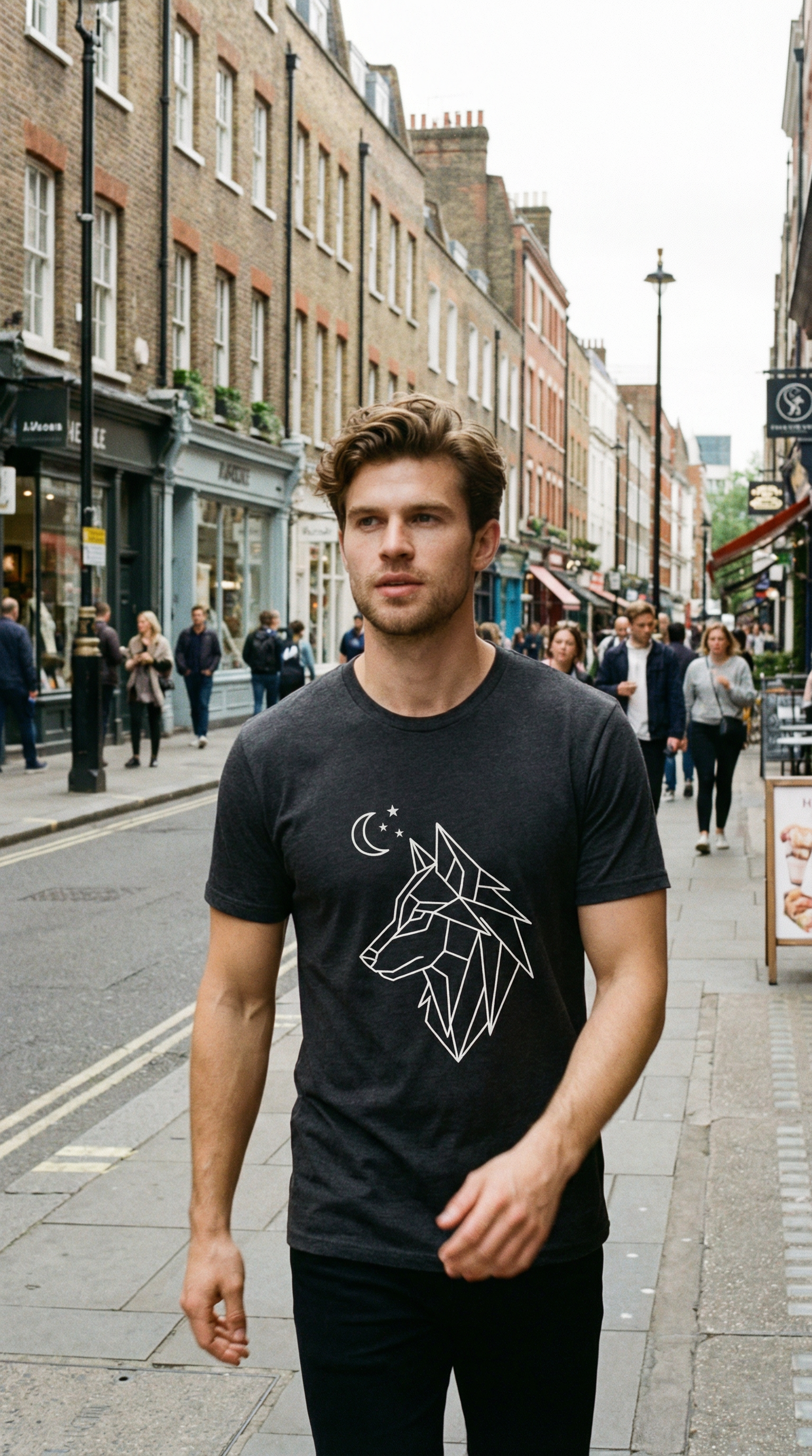 street wear T-shirt MOEBEER  Man wearing a black t-shirt with a white wolf design on a city street.