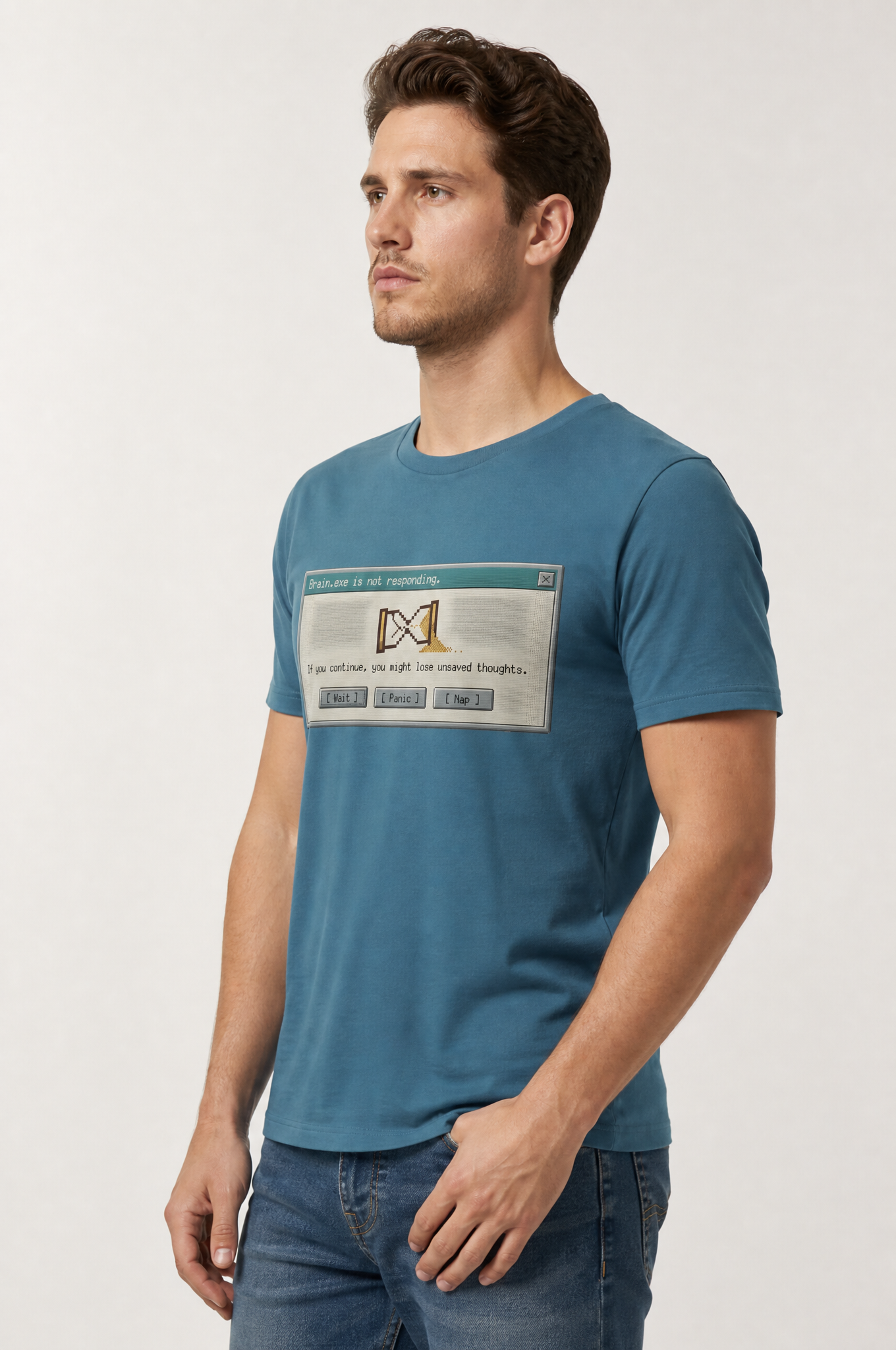 Man wearing a blue t-shirt with a graphic design on a light gray background #Heather Deep Teal