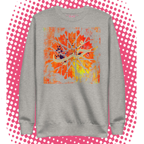 Gray sweatshirt with a colorful abstract design on a polka dot background