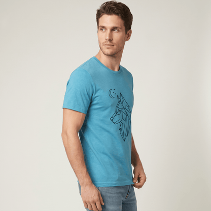 Man wearing a blue t-shirt with a wolf graphic on a plain background #Heather Aqua