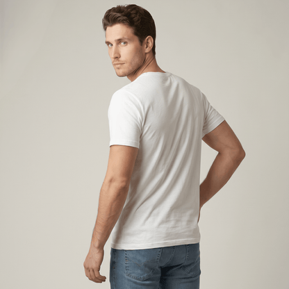 Man wearing a plain white t-shirt and blue jeans against a neutral background #White