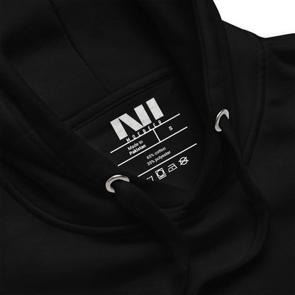 Inside label of a black Arabic calligraphy hoodie made in Pakistan with size details and care instructions. #Black