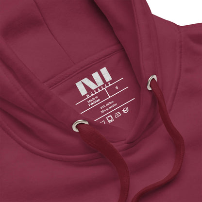 Close-up of the inside label of the maroon Arabic calligraphy hoodie showing care instructions and fabric details #Maroon